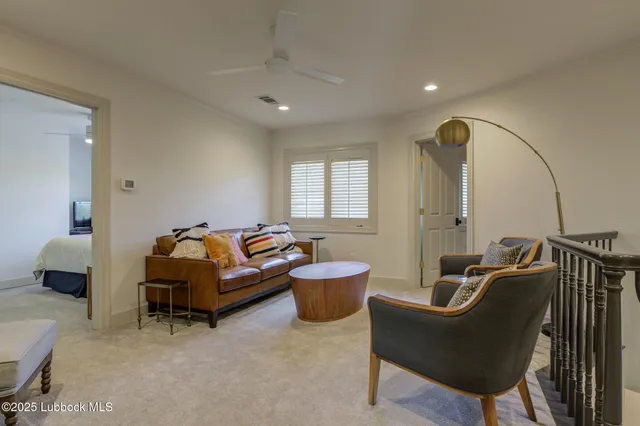 a bedroom with a bed and a television