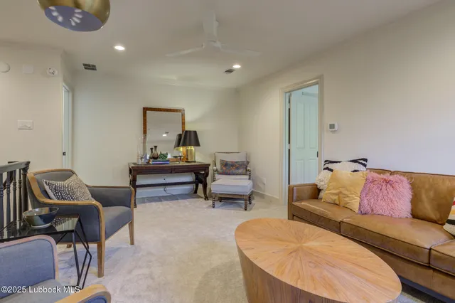 a bathroom with a granite countertop toilet sink and mirror