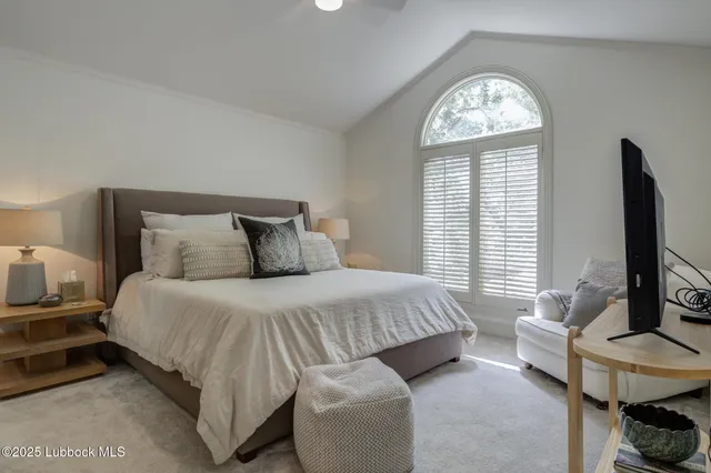 a bedroom with a bed and a couch