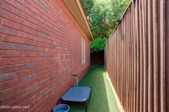 a view of house with backyard swimming pool and sitting area