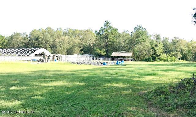 3098 Pacetti Road, Unit G St. Augustine, FL 32092 - Photo 13 of 17 a view of yard with swimming pool and trees