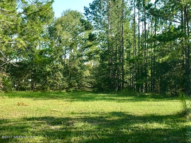 3098 Pacetti Road, Unit G St. Augustine, FL 32092 - Photo 3 of 17 a view of a park that has large trees