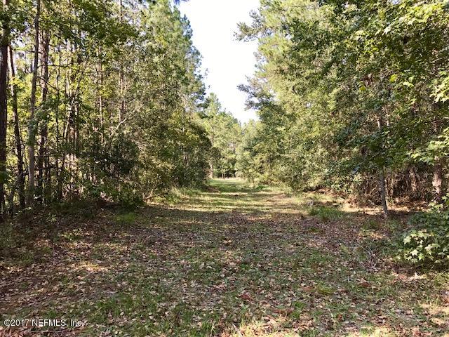 3098 Pacetti Road, Unit G St. Augustine, FL 32092 - Photo 5 of 17 a view of outdoor space and a yard