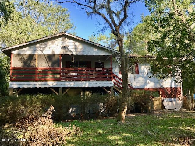 3098 Pacetti Road, Unit G St. Augustine, FL 32092 - Photo 6 of 17 a view of a wooden deck with a yard