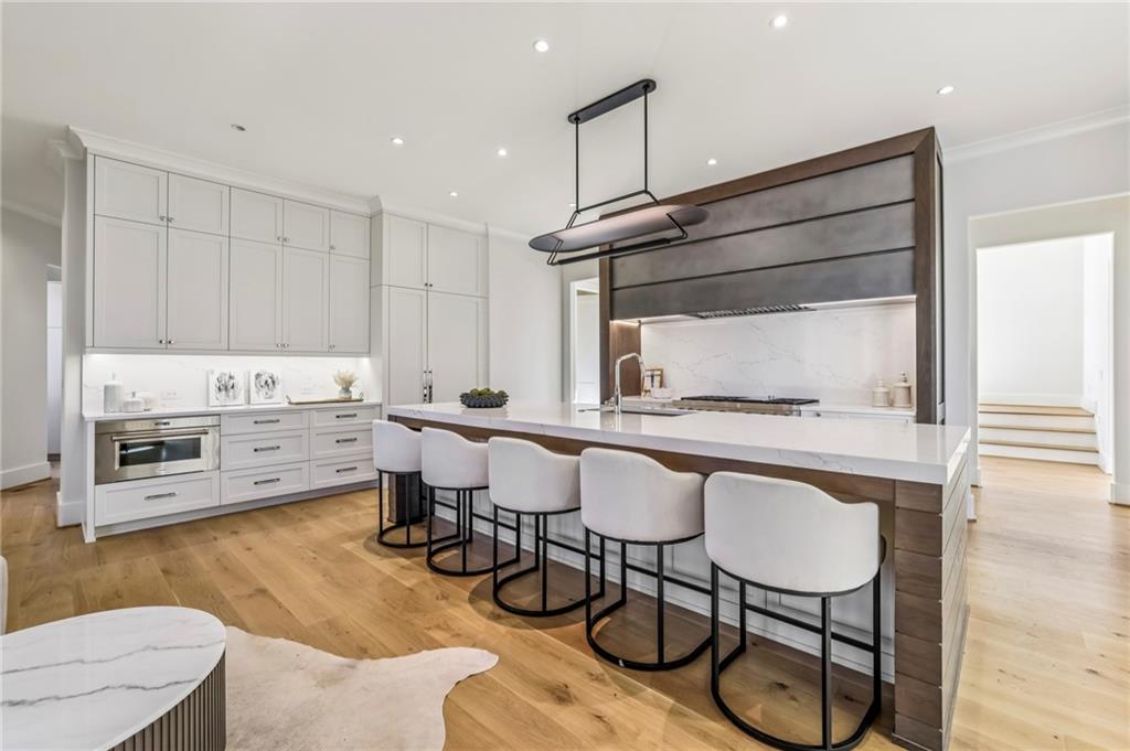 825 Kenry Court Atlanta, GA 30342 - Photo 13 of 49 a kitchen with a sink cabinets and window