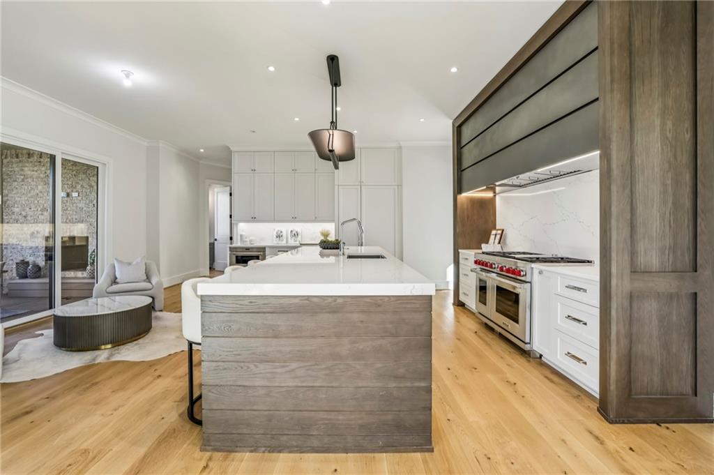 825 Kenry Court Atlanta, GA 30342 - Photo 14 of 49 a kitchen with a stove a refrigerator and a fireplace