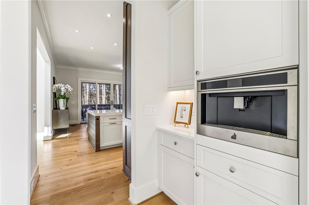 825 Kenry Court Atlanta, GA 30342 - Photo 15 of 49 a living room with stainless steel appliances kitchen island furniture and a fireplace