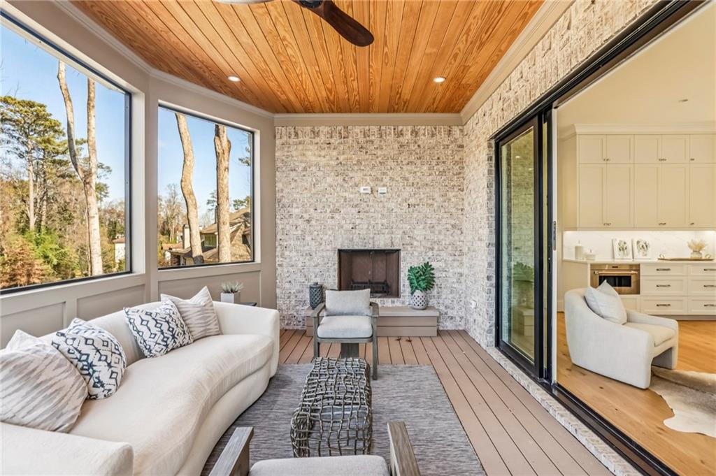 825 Kenry Court Atlanta, GA 30342 - Photo 18 of 49 a living room with furniture and a fireplace