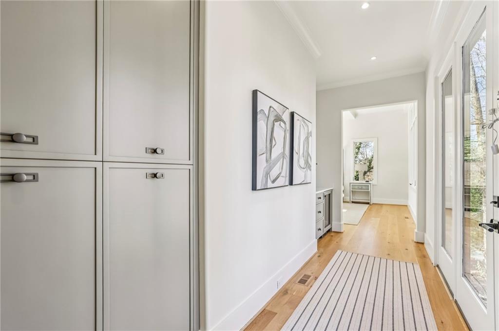 825 Kenry Court Atlanta, GA 30342 - Photo 19 of 49 a view of a hallway with wooden floor and staircase