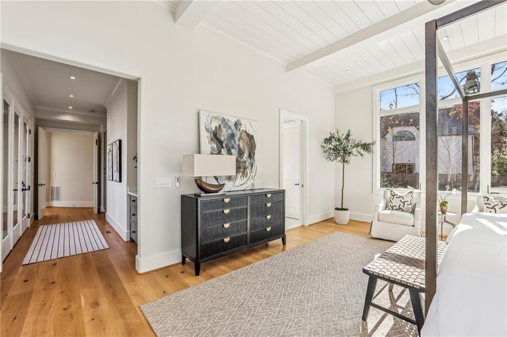 825 Kenry Court Atlanta, GA 30342 - Photo 21 of 49 a bedroom with furniture and a wooden floor