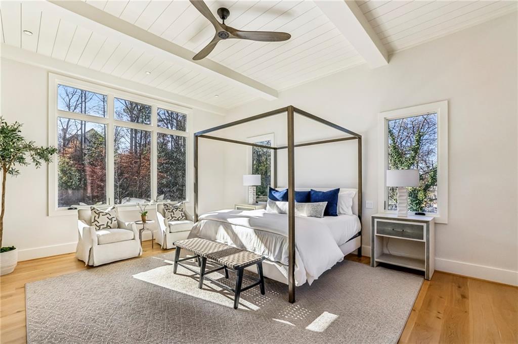 825 Kenry Court Atlanta, GA 30342 - Photo 23 of 49 a bedroom with a bed and a couch