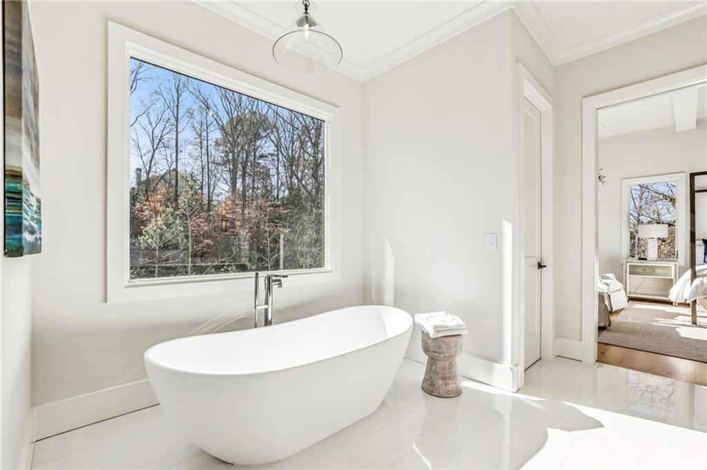 825 Kenry Court Atlanta, GA 30342 - Photo 28 of 49 a white bath tub sitting next to a white sink