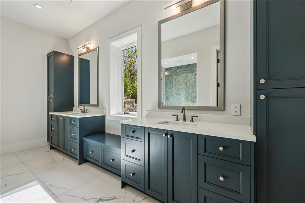 825 Kenry Court Atlanta, GA 30342 - Photo 34 of 49 a bathroom with double sink and a mirror