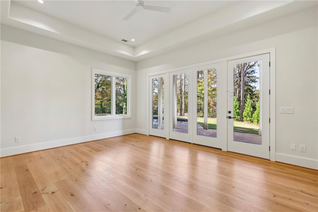 825 Kenry Court Atlanta, GA 30342 - Photo 43 of 49 an empty room with wooden floor and windows