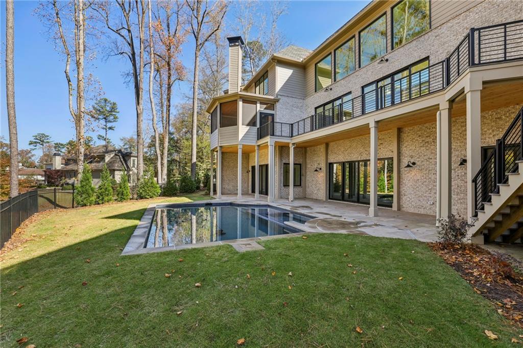 825 Kenry Court Atlanta, GA 30342 - Photo 47 of 49 a view of a house with a yard and sitting area