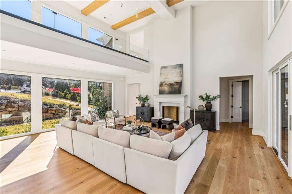 825 Kenry Court Atlanta, GA 30342 - Photo 8 of 49 a living room with furniture fireplace and a large window