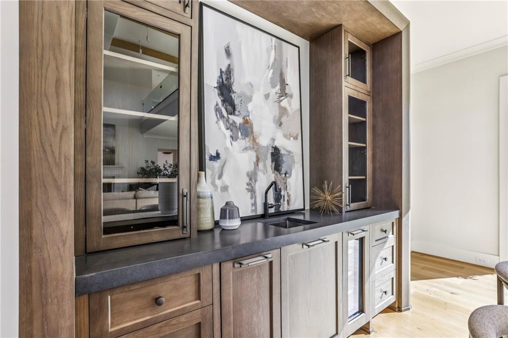 825 Kenry Court Atlanta, GA 30342 - Photo 9 of 49 a view of a hallway with wooden floor and a cabinet