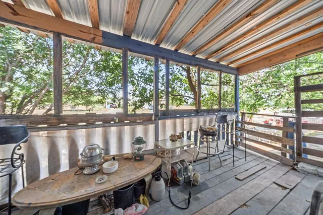 a view of city from a balcony dining area with furniture
