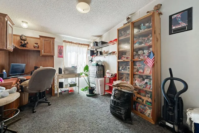 a view of a workspace with furniture and toys