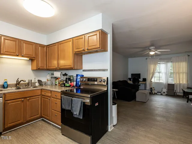 a kitchen with a sink cabinets and appliances