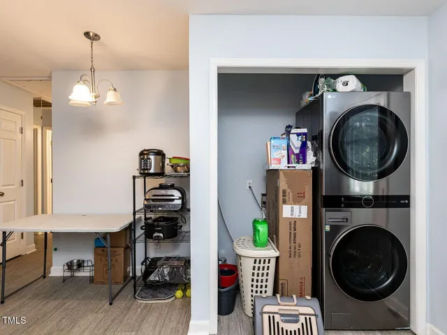 a view of a hallway with washer and dryer