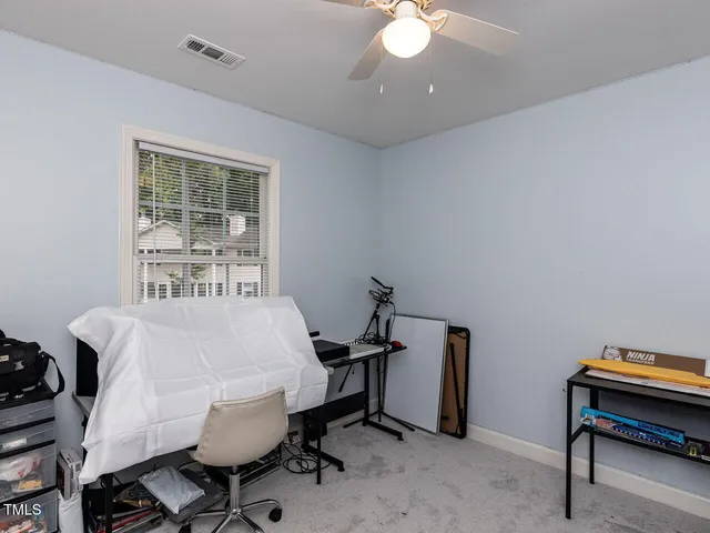 a bedroom with a bed and a table