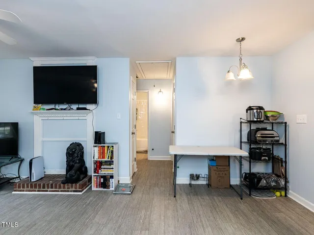 a view of a livingroom with furniture and a flat screen tv