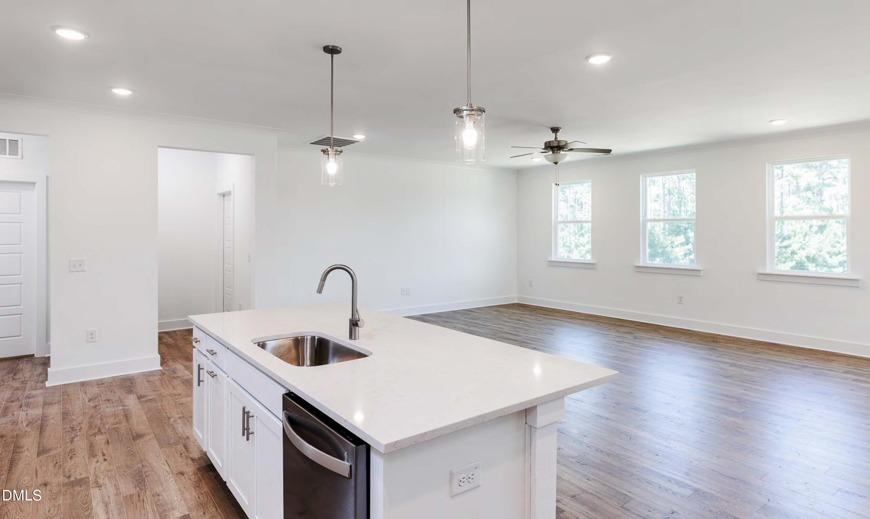 53 Mendenhall Drive Angier, NC 27501 - Photo 6 of 11 a kitchen that has a sink a stove and a window