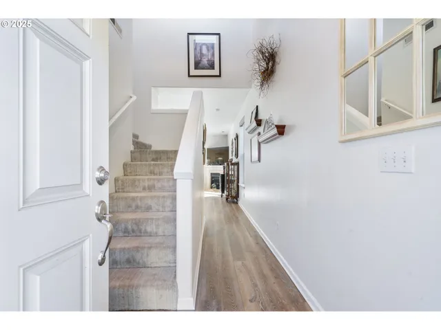a view of a hallway with staircase
