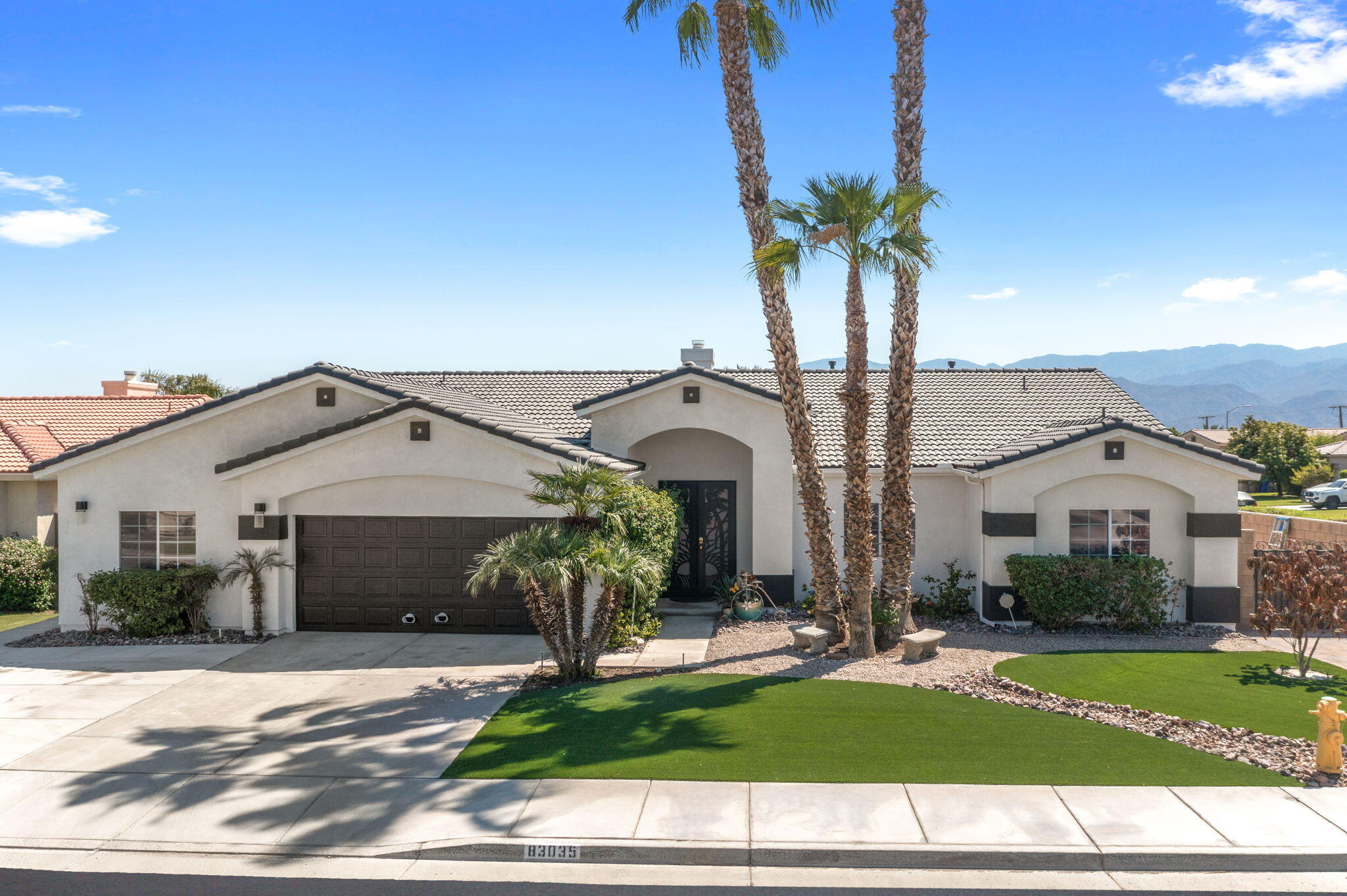 83035 Exeter Court Thermal, CA 92274 - Photo 1 of 38 a house view with a garden space