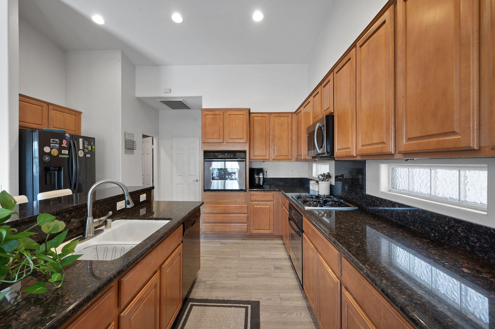 83035 Exeter Court Thermal, CA 92274 - Photo 12 of 38 a kitchen with granite countertop a sink and cabinets