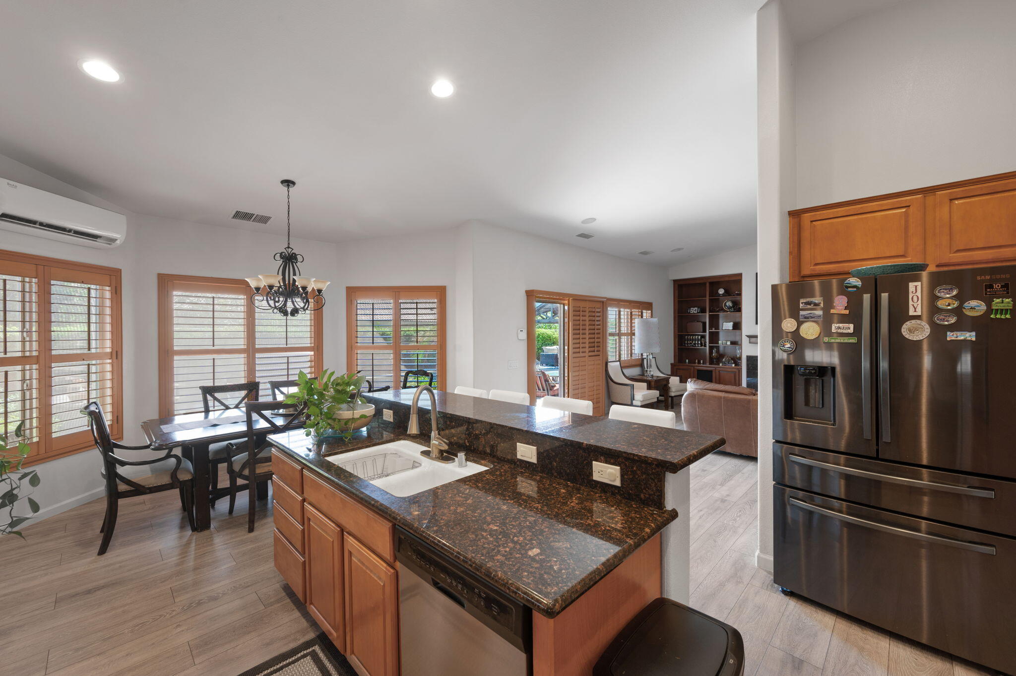 83035 Exeter Court Thermal, CA 92274 - Photo 13 of 38 a kitchen with stainless steel appliances granite countertop a refrigerator a stove and a sink with cabinets