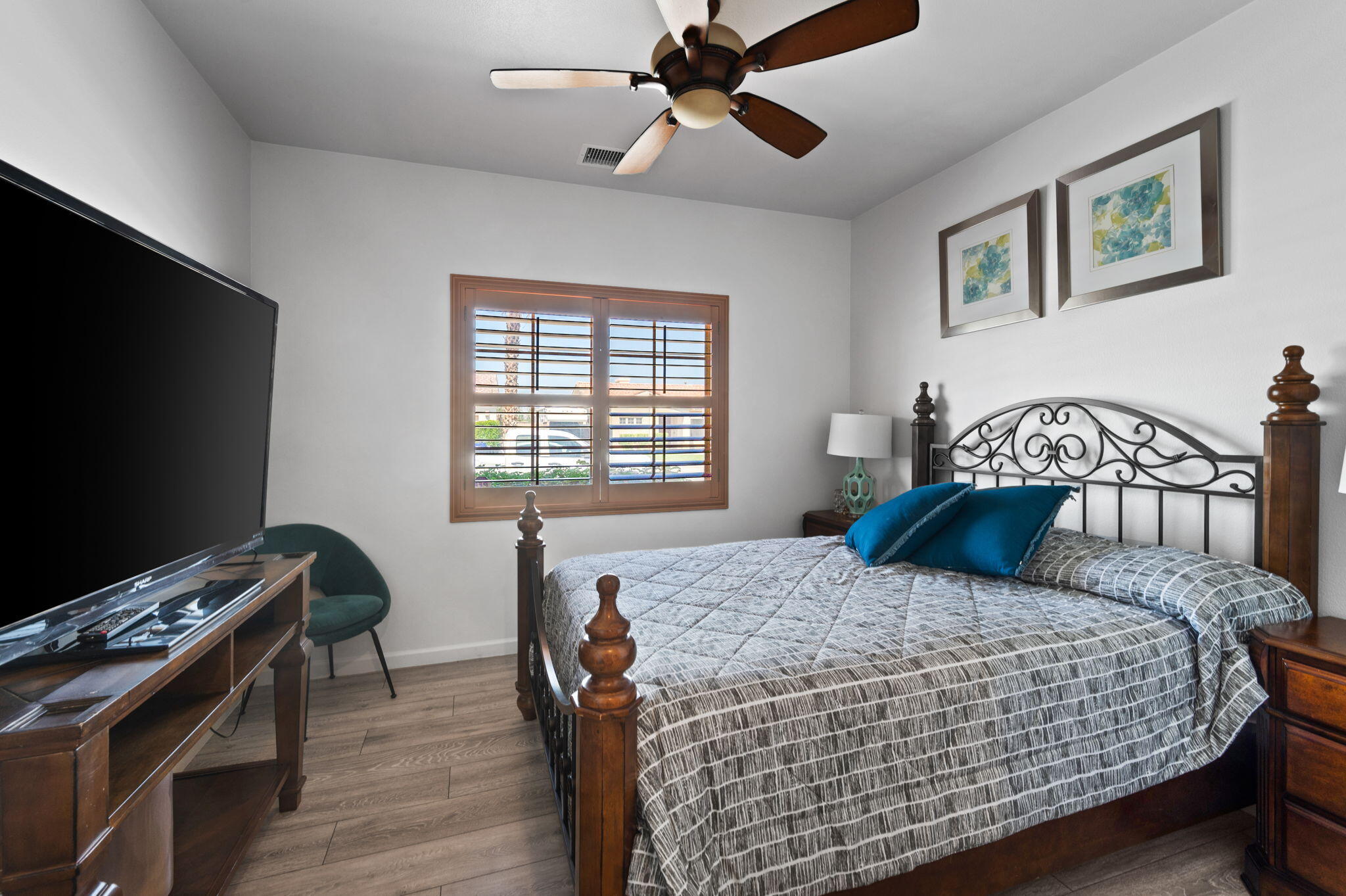 83035 Exeter Court Thermal, CA 92274 - Photo 17 of 38 a bedroom with a bed and a flat screen tv
