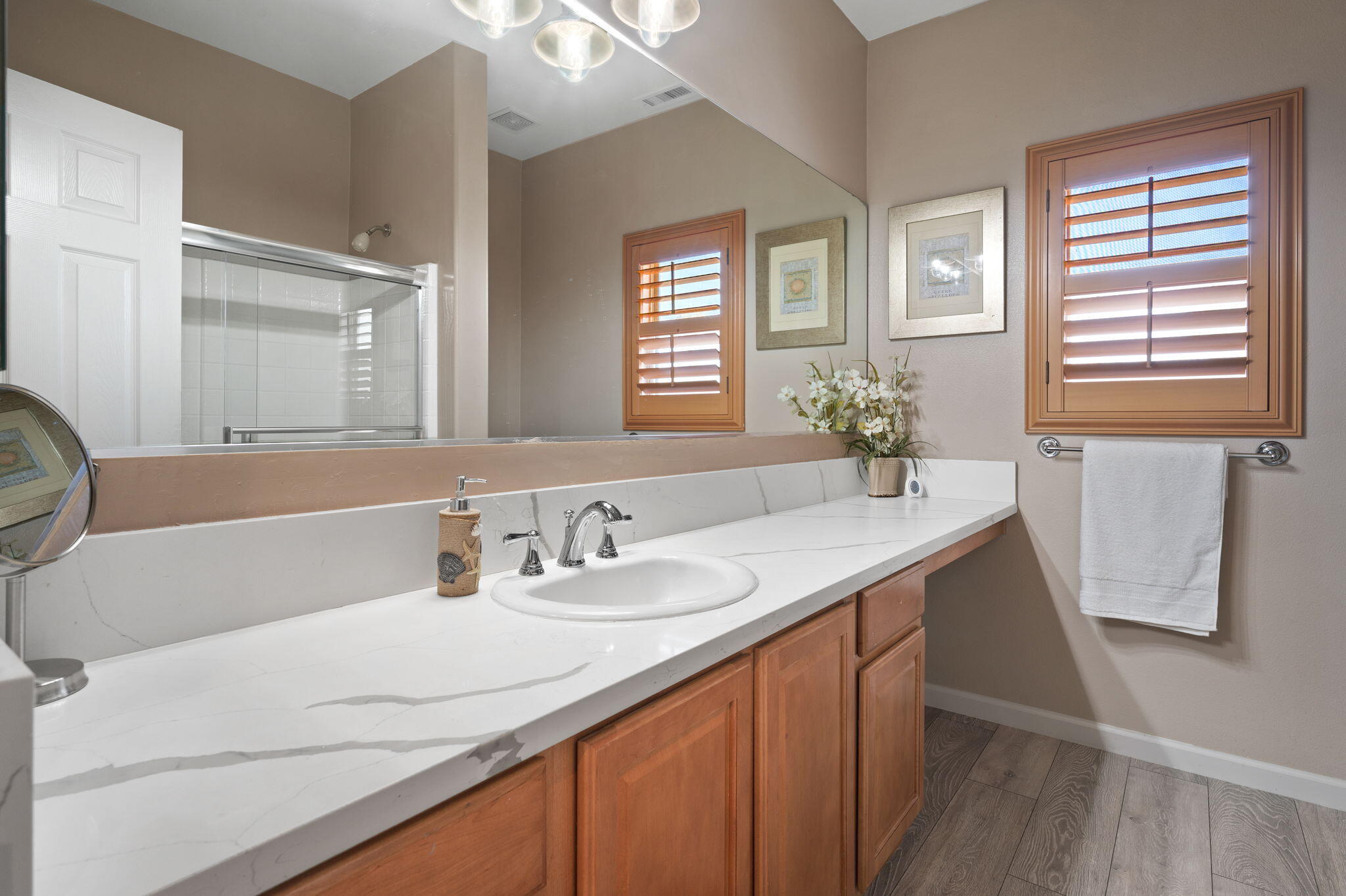 83035 Exeter Court Thermal, CA 92274 - Photo 19 of 38 a bathroom with a sink and a mirror