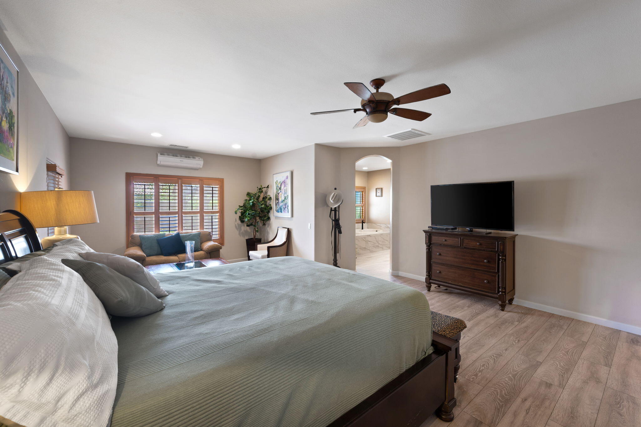 83035 Exeter Court Thermal, CA 92274 - Photo 24 of 38 a bedroom with a bed and a flat screen tv