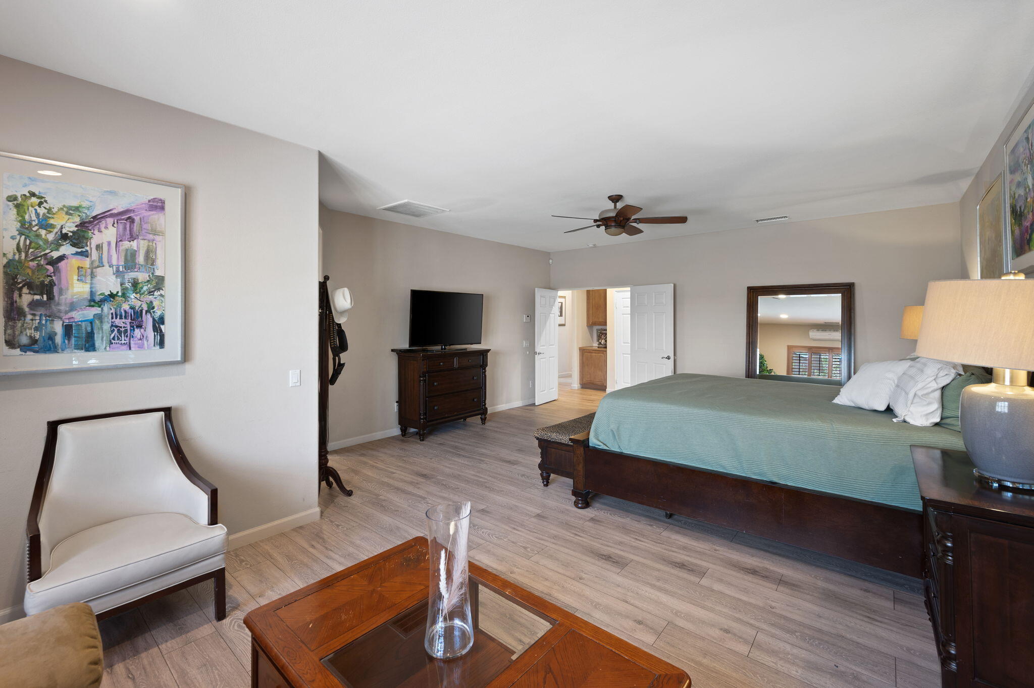 83035 Exeter Court Thermal, CA 92274 - Photo 25 of 38 a bedroom with a bed and wooden floor