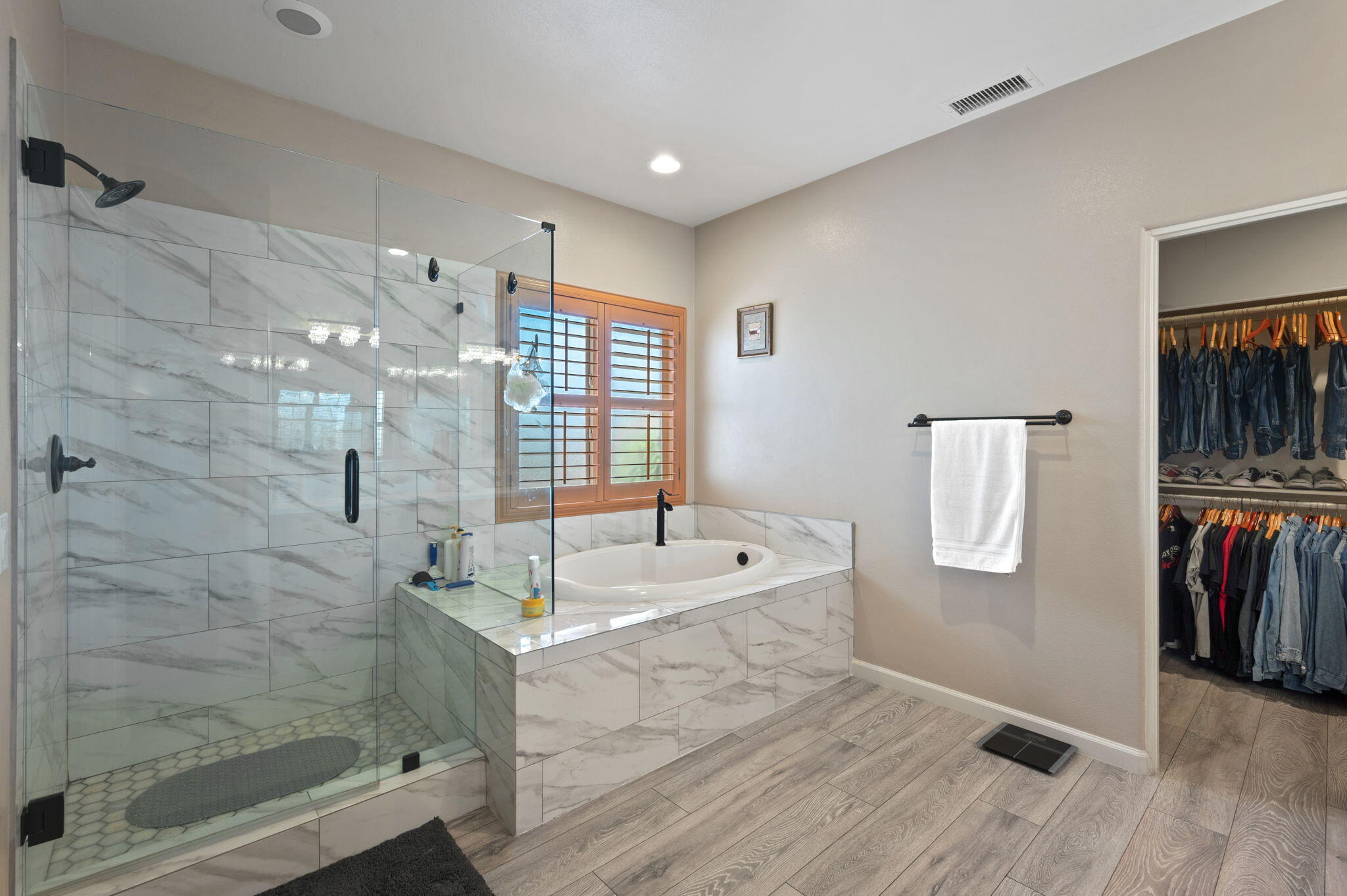 83035 Exeter Court Thermal, CA 92274 - Photo 26 of 38 a spacious bathroom with a granite countertop sink a toilet a mirror and shower