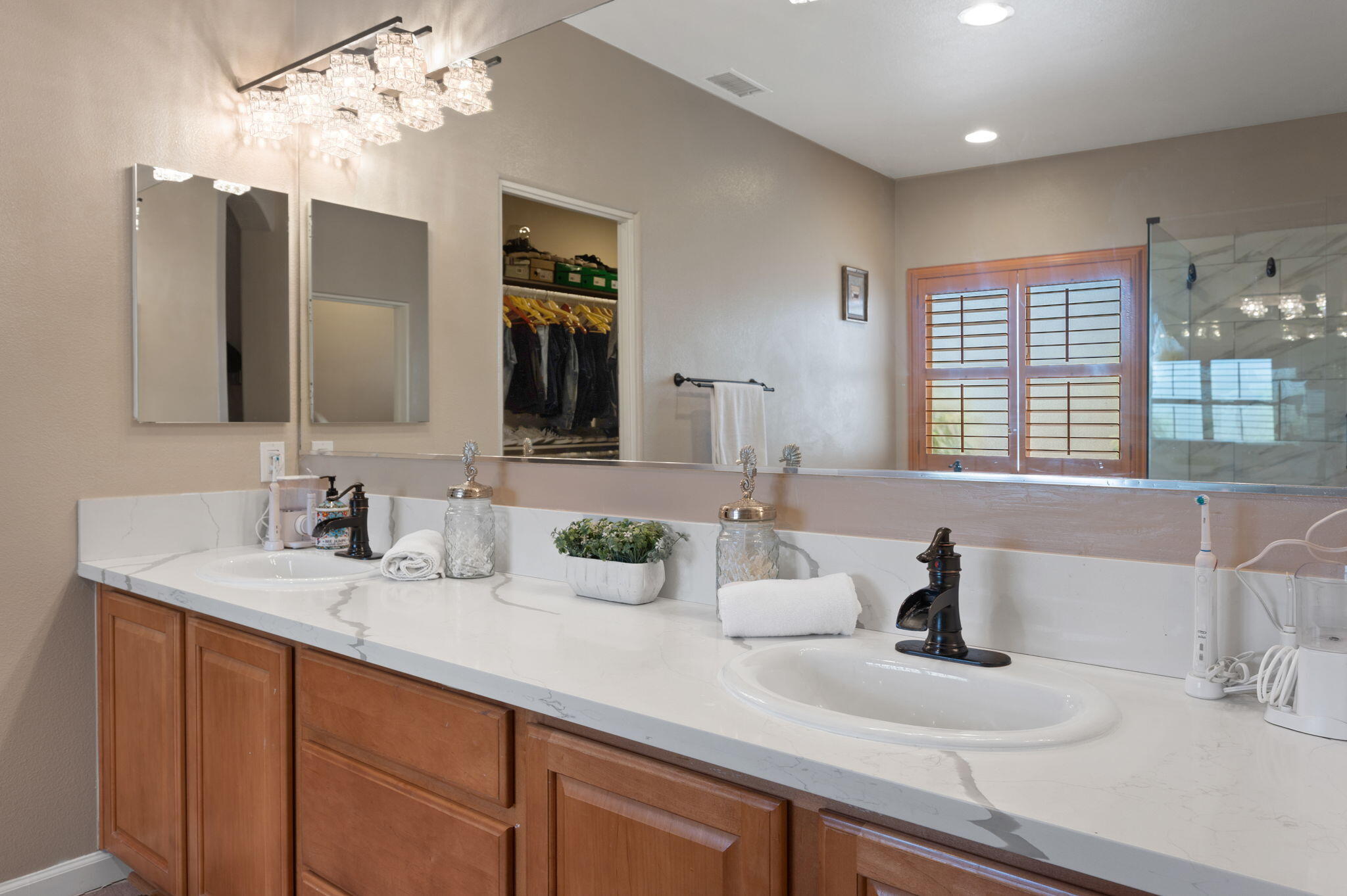 83035 Exeter Court Thermal, CA 92274 - Photo 28 of 38 a bathroom with double vanity sinks a vanity and a mirror