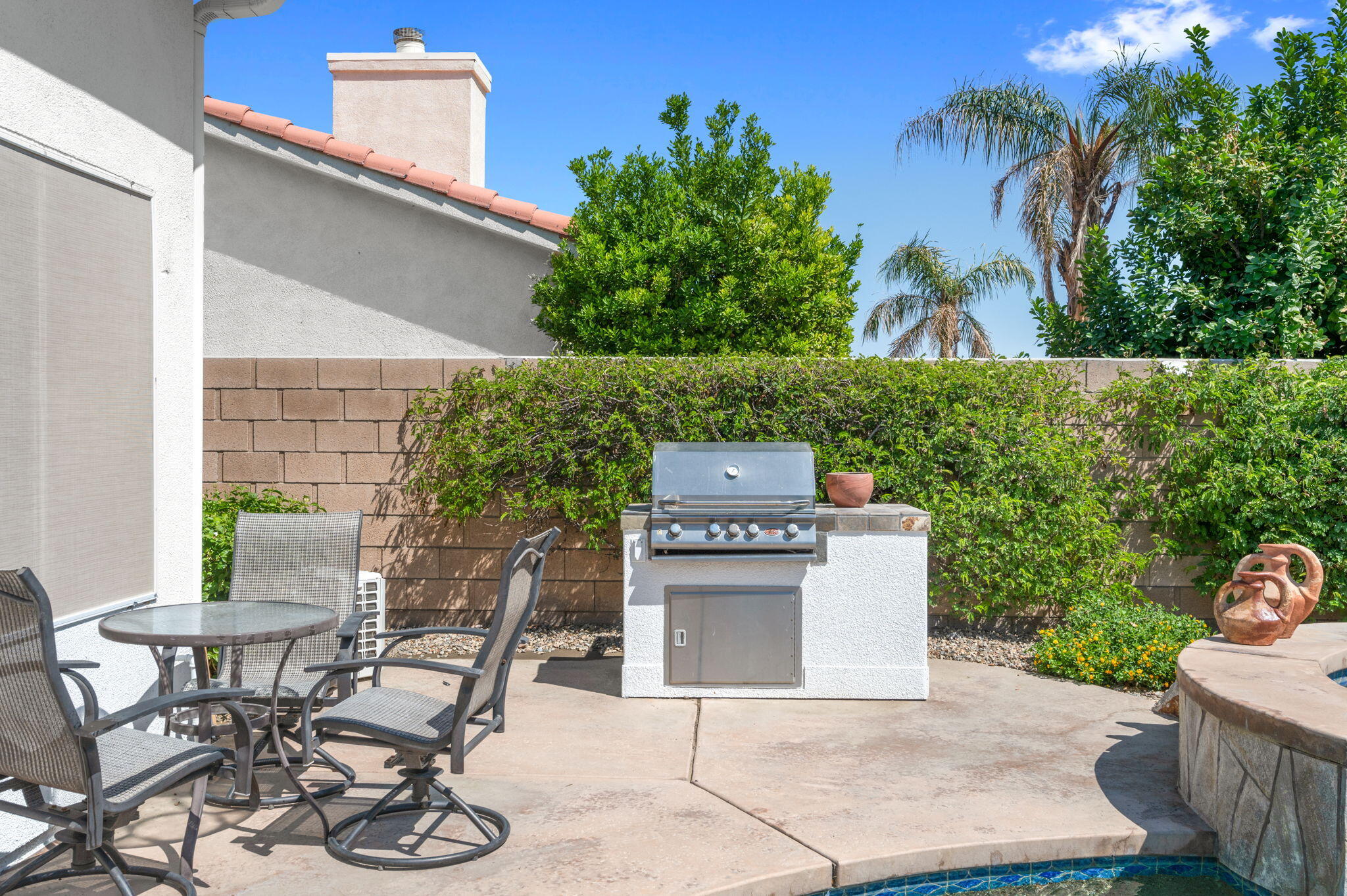 83035 Exeter Court Thermal, CA 92274 - Photo 30 of 38 a view of a patio with table and chairs and potted plants