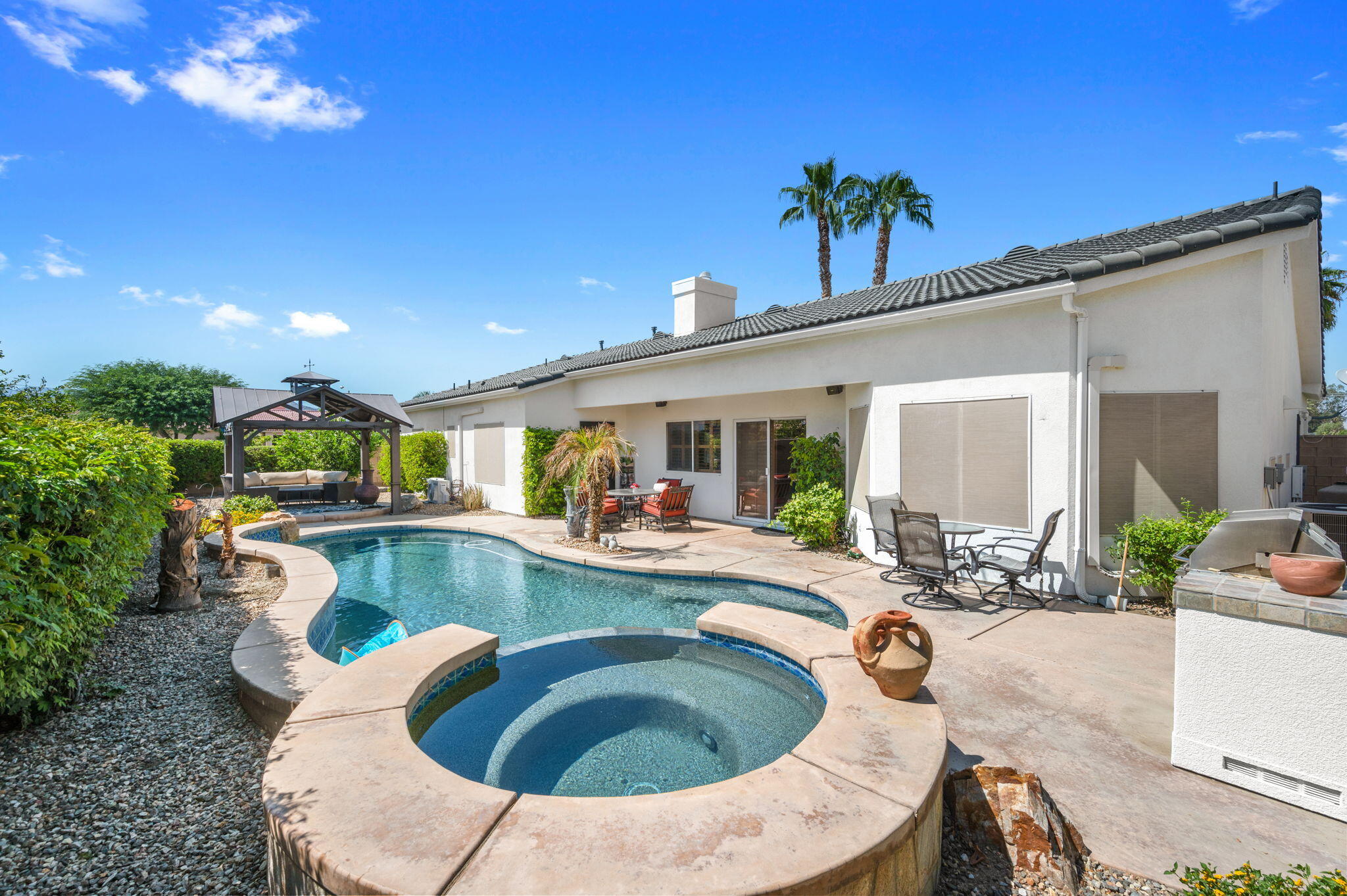 83035 Exeter Court Thermal, CA 92274 - Photo 32 of 38 a view of a swimming pool with outdoor seating