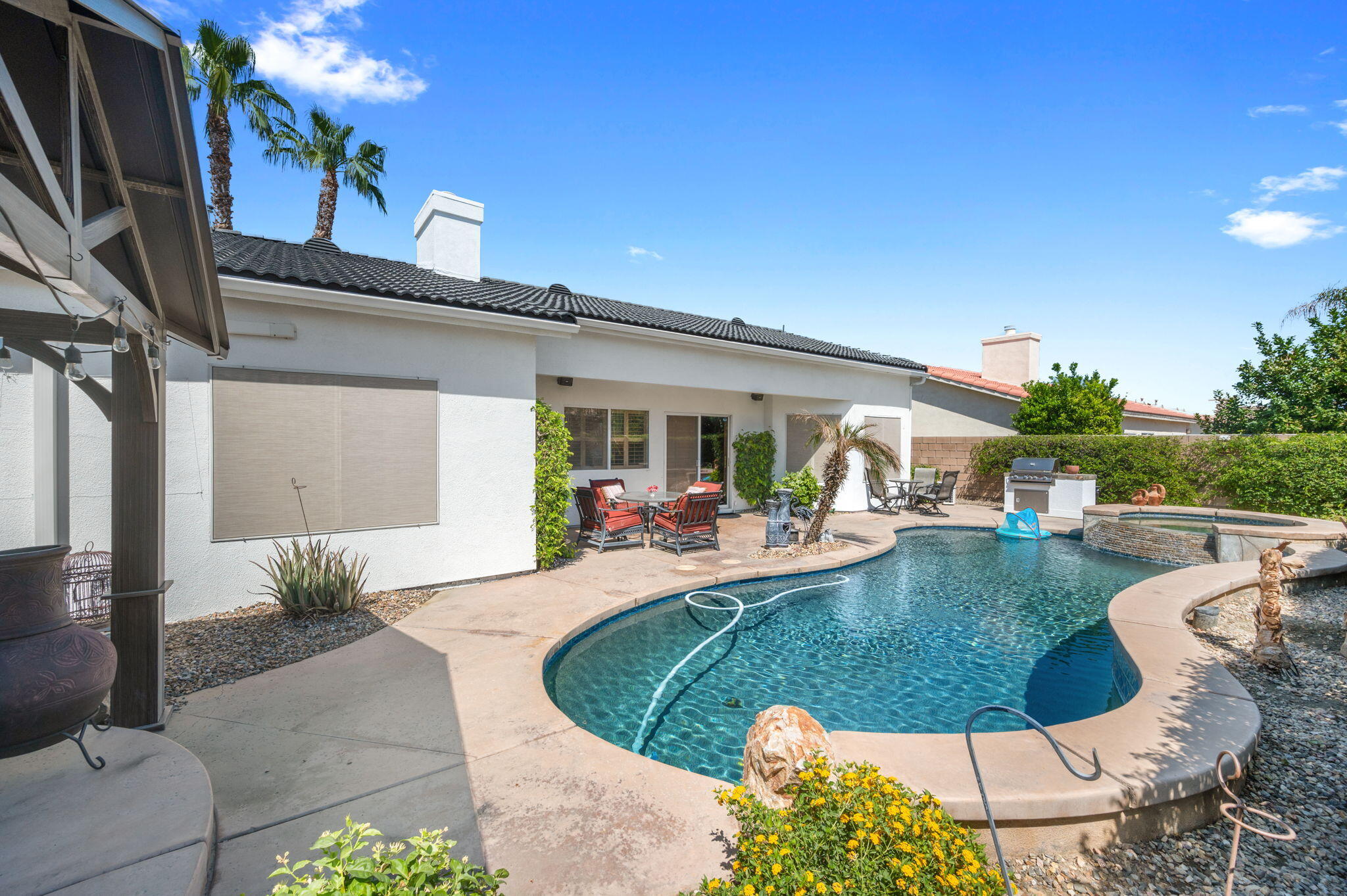 83035 Exeter Court Thermal, CA 92274 - Photo 36 of 38 a view of a house with backyard porch and patio