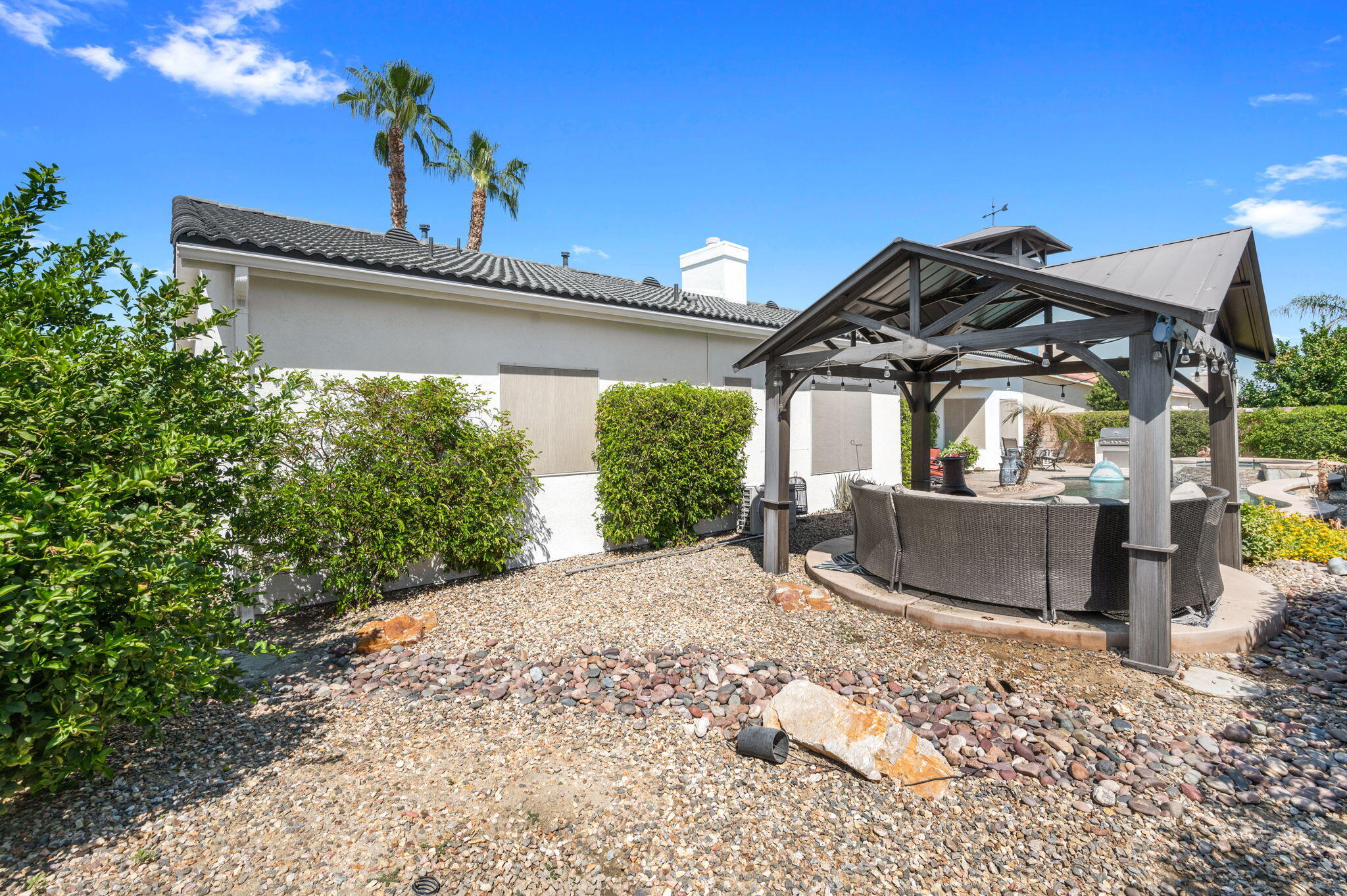 83035 Exeter Court Thermal, CA 92274 - Photo 37 of 38 a front view of a house with a garden