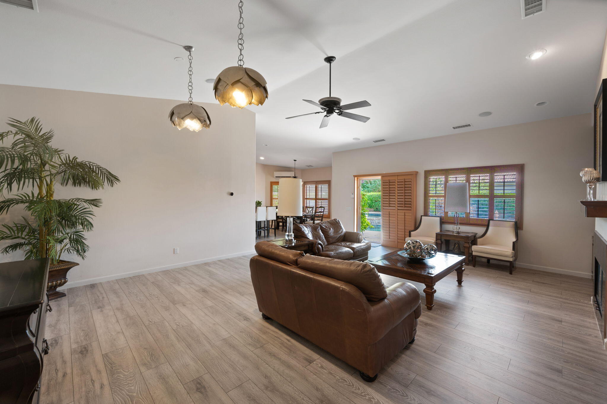 83035 Exeter Court Thermal, CA 92274 - Photo 4 of 38 a living room with furniture and a chandelier