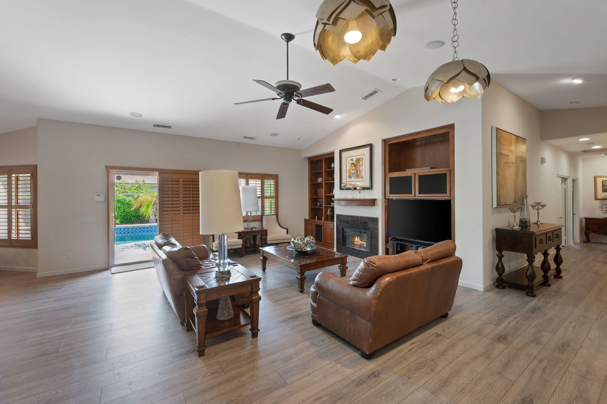 83035 Exeter Court Thermal, CA 92274 - Photo 6 of 38 a living room with furniture potted plant and a large window