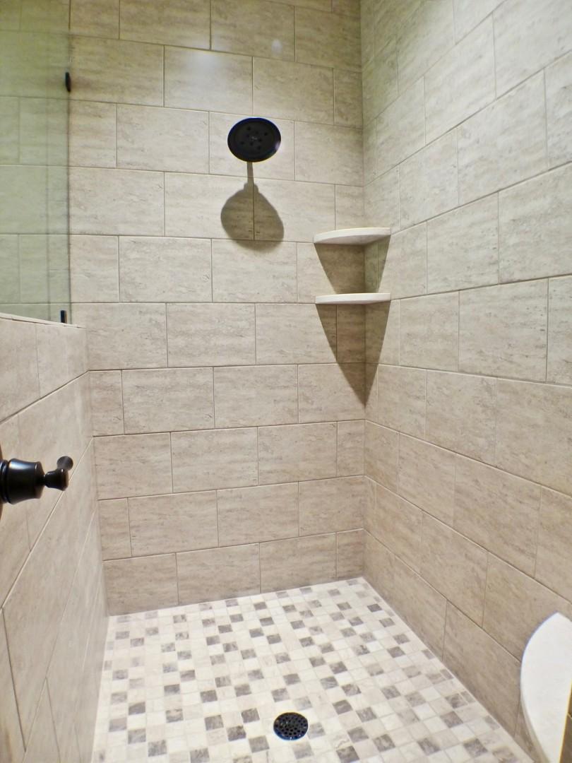 1412 McDuffie Road Biscoe, NC 27209 - Photo 19 of 30 Enjoy this large tile walk in shower with rain head shower head.