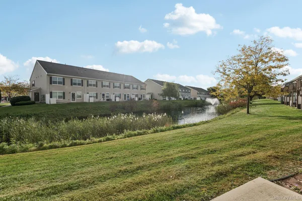 a view of a house with a big yard