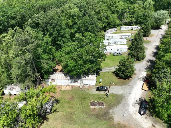 an aerial view of a house with a garden