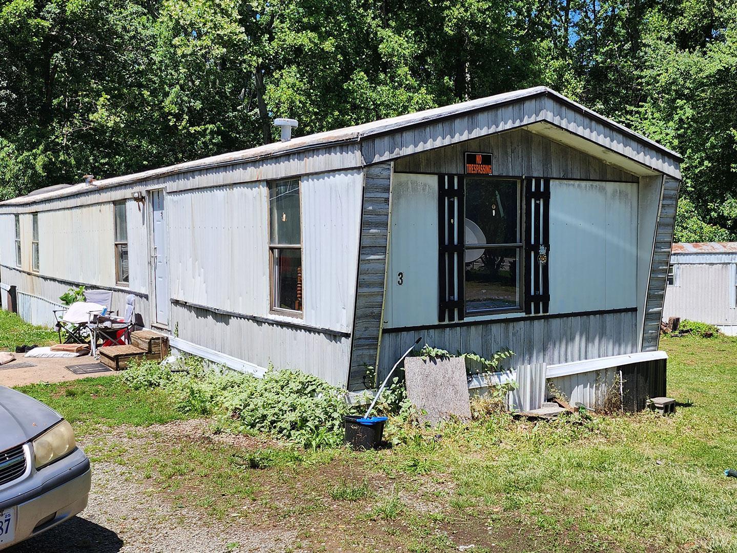 112 Ramsey Road Gretna, VA 24557 - Photo 6 of 9 a front view of a house with garden