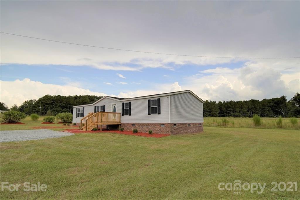 283 Ballard Spring Road, Unit 3276 Morven, NC 28119 - Photo 1 of 48 a view of a big house with a big yard