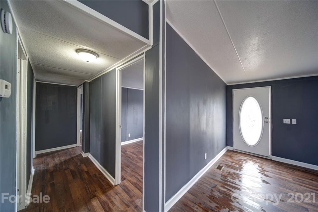 283 Ballard Spring Road, Unit 3276 Morven, NC 28119 - Photo 13 of 48 a view of a hallway with wooden floor